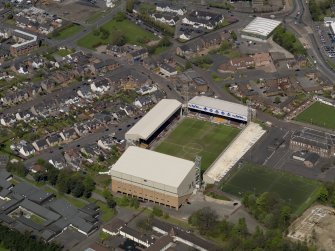 Oblique aerial view centred on the football ground, taken from the SE.