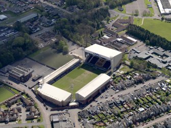 Oblique aerial view centred on the football ground, taken from the NW.