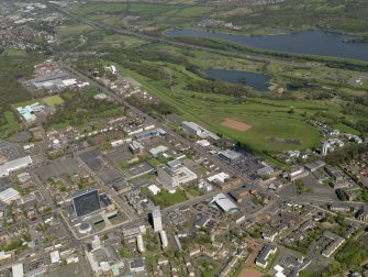 General oblique aerial view centred on the racecourse with the town adjacent, taken from the S.