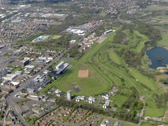 General oblique aerial view centred on the racecourse, taken from the SE.