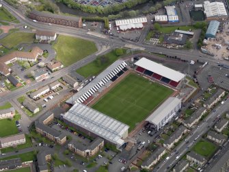 Oblique aerial view centred on the football ground, taken from the SW.