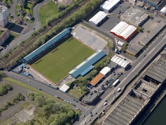 Oblique aerial view centred on the football ground, taken from the NE.