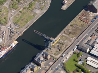 Oblique aerial view centred on the dock with the crane adjacent, taken from the WNW.