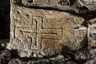 Village Bay, House 16. Detail of incised cross (flash).