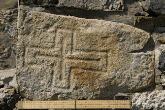 Village Bay, House 16. Detail of incised cross (daylight with scale).