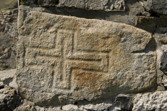 Village Bay, House 16. Detail of incised cross (daylight).