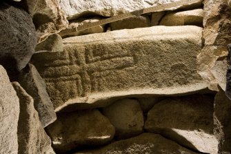 Village Bay, cleit 74. View of cross incised stone reused as a roof lintel (with scale).