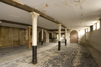 Interior.  First floor. General view of square section columns.