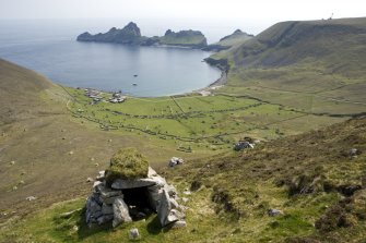 Village Bay, Hirta, St Kilda. 
General view from N with cleit in foreground, including the Ministry of Defence Establishment, the radar station on Mullach Sgar and Dun beyond.