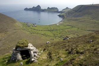 Hirta, Village Bay. General view from N with cleit in foreground, including the Ministry of Defence Establishment, the radar station on Mullach Sgar and Dun beyond.