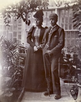 Portrait of Kate Vaughn and son Neil in the conservatory, Kinnaird House.
