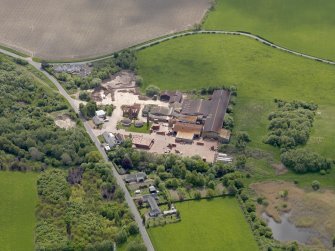 Oblique aerial view centred on the brickworks, taken from the N.