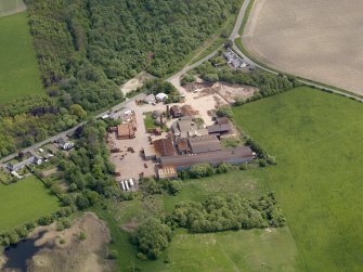 Oblique aerial view centred on the brickworks, taken from the WNW.