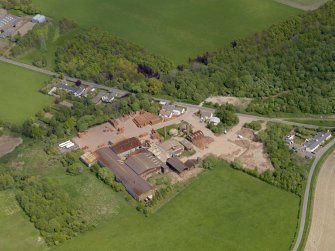 Oblique aerial view centred on the brickworks, taken from the SW.