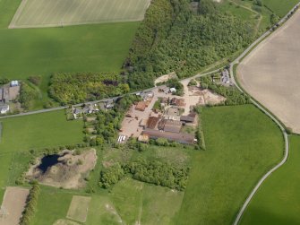 Oblique aerial view centred on the brickworks, taken from the W.