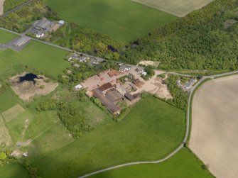 Oblique aerial view centred on the brickworks, taken from the SW.