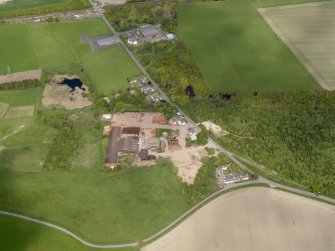 Oblique aerial view centred on the brickworks, taken from the S.