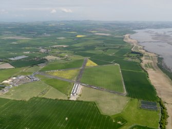 General oblique aerial view centred on the airfield, taken from the SW.