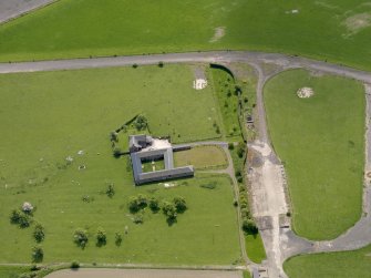 Oblique aerial view centred on Muirhouses Farmsteading with the control tower adjacent, taken from the NNW.