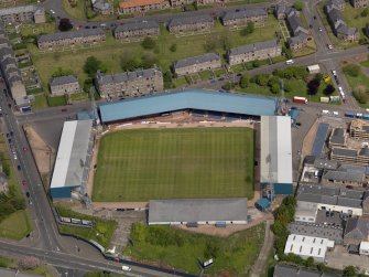 Oblique aerial view centred on the football ground, taken from the SSW.