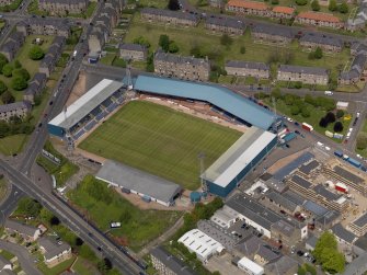 Oblique aerial view centred on the football ground, taken from the SE.