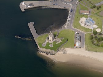 Oblique aerial view centred on the castle, taken from the SE.