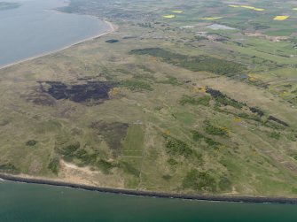 General oblique aerial view centred on the Links with the firing range adjacent, taken from the E.