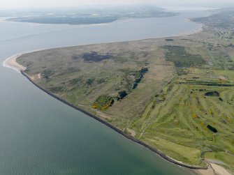 General oblique aerial view centred on the Links with the firing range and golf course adjacent, taken from the ENE.