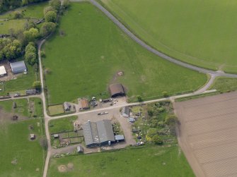 Oblique aerial view centred on the aircraft hangars with Hatton House adjacent, taken from the NE.