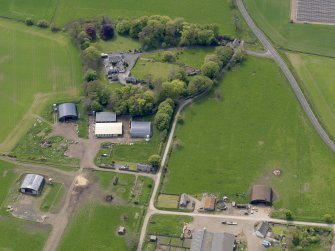 Oblique aerial view centred on the aircraft hangars with Hatton House adjacent, taken from the NNE.