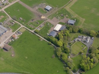 Oblique aerial view centred on the aircraft hangars with Hatton House adjacent, taken from the WNW.