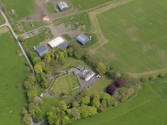 Oblique aerial view centred on the aircraft hangars with Hatton House adjacent, taken from the WSW.