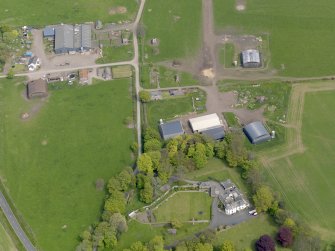 Oblique aerial view centred on the aircraft hangars with Hatton House adjacent, taken from the SW.