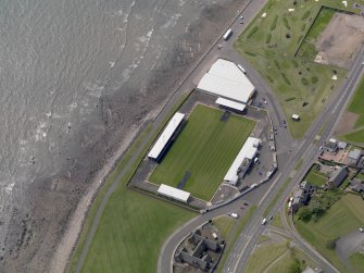 Oblique aerial view centred on the football ground, taken from the ENE.