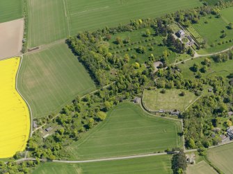 General oblique aerial view centred on the country house with the policies adjacent, taken from the WNW.