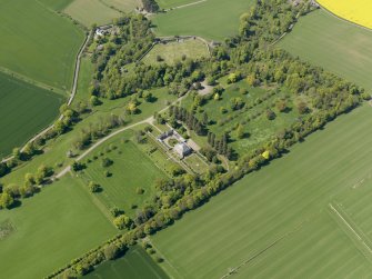 General oblique aerial view centred on the country house with the policies adjacent, taken from the SE.