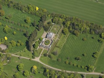 Oblique aerial view centred on the house with the gardens adjacent, taken from the WSW.