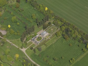 Oblique aerial view centred on the house with the gardens adjacent, taken from the SW.
