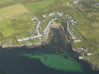Oblique aerial view centred on the vilage of Portnahaven, taken from the SSW.