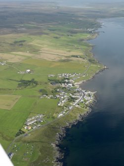 General oblique aerial view looking along the E coast of the Rinns of Islay with Port Charlotte in the centre, taken from the SSW.