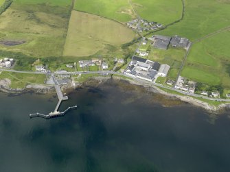 Oblique aerial view of Bruichladdich distillery and pier, taken from the ESE.