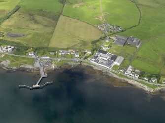 Oblique aerial view of Bruichladdich distillery and pier, taken from the ESE.