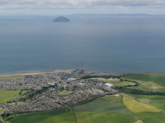 General oblique aerial view of the town with Ailsa Craig and Kintyre in the distance, taken from the E.