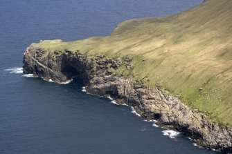 St Kilda, Hirta. The E side of Glen Bay from the SW, showing the natural arch at Gob na h-Airde.