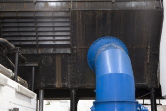 Interior. Turbine house, detail of pentrough or conduit which would have originally fed the waterwheels from the lade. This still is in use, feeding water to the turbines.