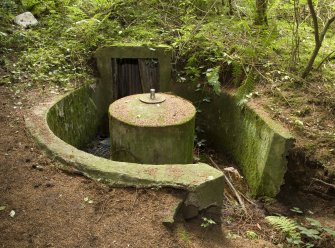 View from E showing emplacement, entrance, concrete mounting and magazine.