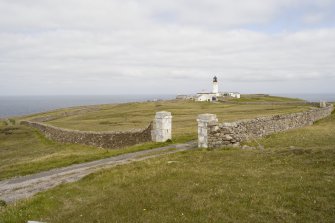 View of the Cape Wrath lighthouse (NC27SE 3.00) from the south, also showing the boundary wall (NC27SE 3.05; CWTC08 415), built in 1828.