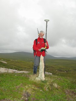 Loch na Seamraig, marker stone, I Parker (RCAHMS) surveying.