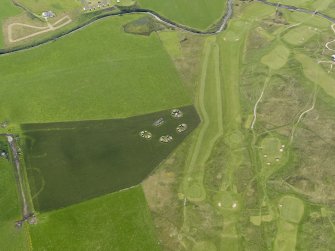 Oblique aerial view centred on the remains of the anit-aircraft battery and the golf course, taken from the NNW.