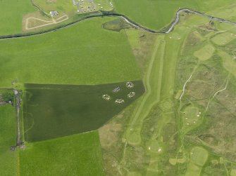 Oblique aerial view centred on the remains of the anit-aircraft battery and the golf course, taken from the NNW.